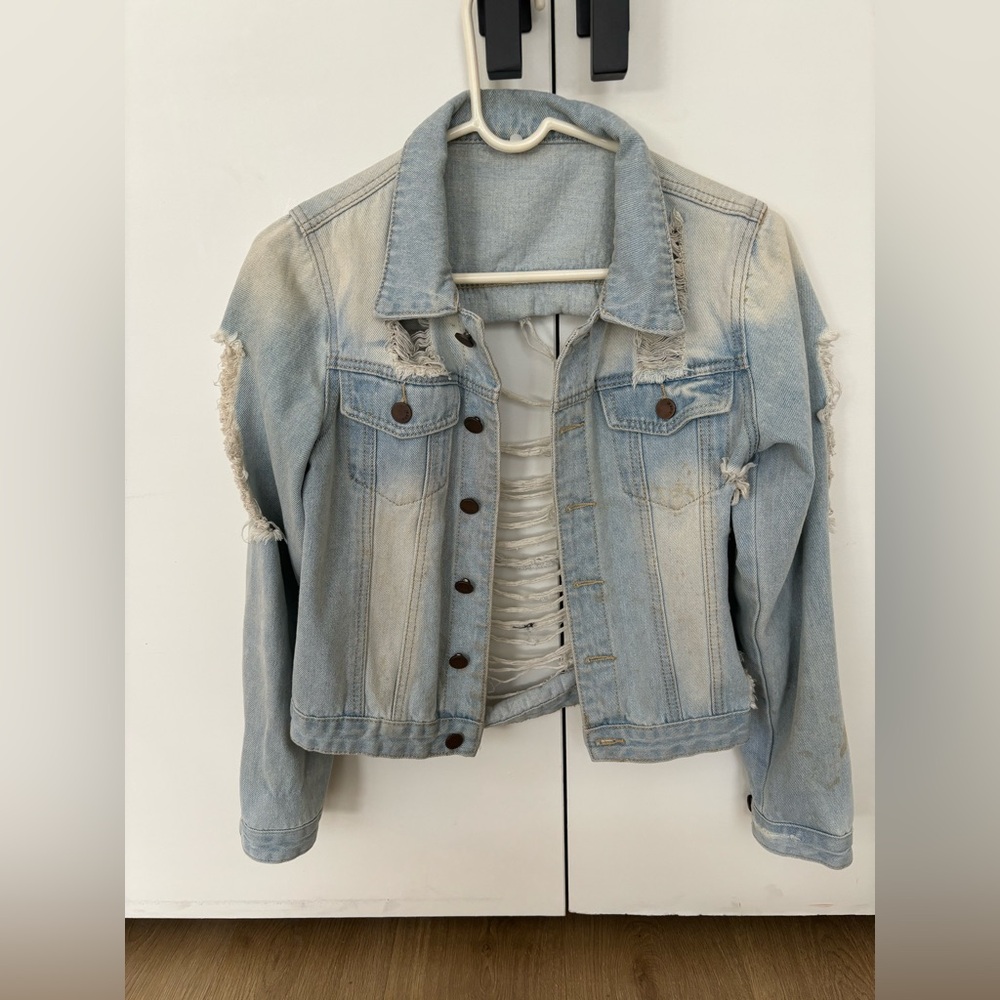 Distressed denim jacket